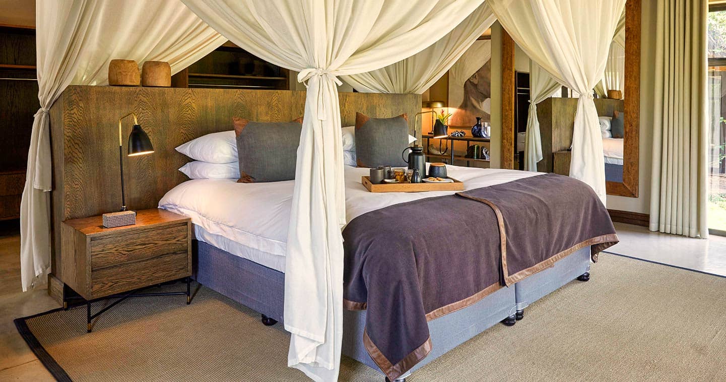 A luxury bedroom at Lion Sands Hinkwenu Residence